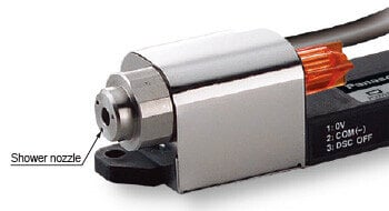 Discharge needle is covered by the nozzle